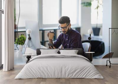 Business, communication and people concept. Happy businessman with computer and use mobile phone at office Wall mural